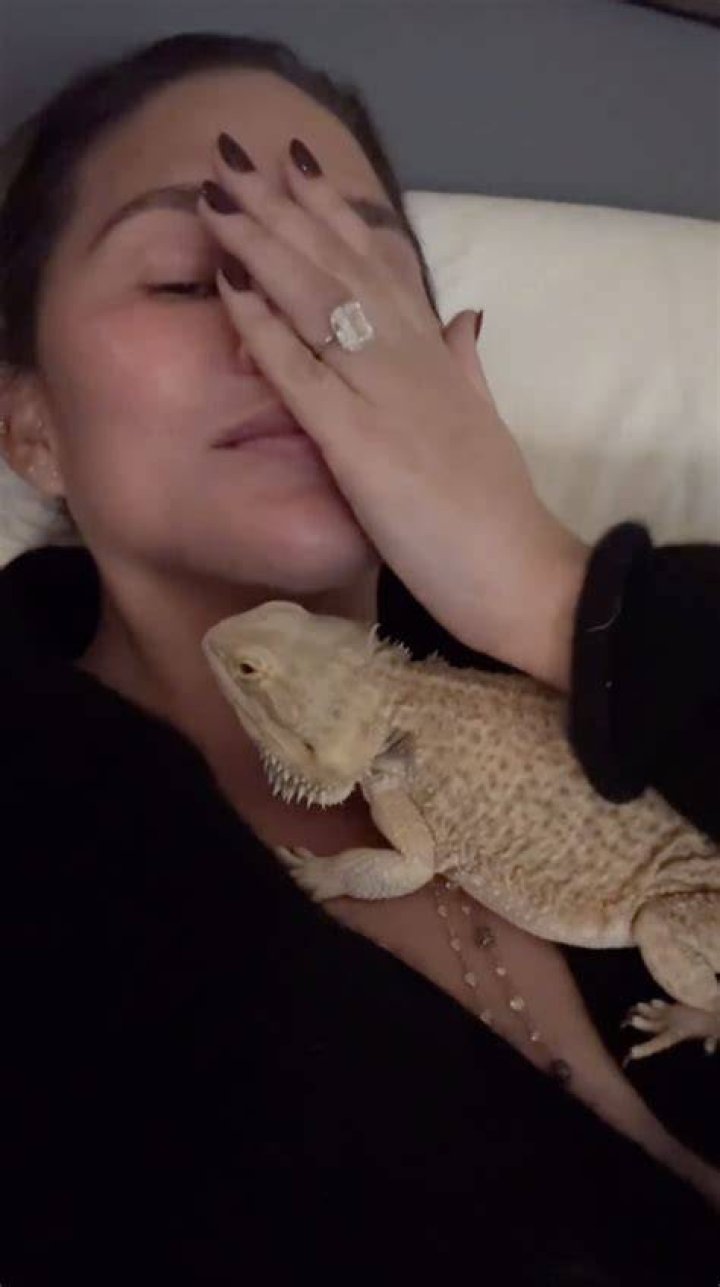 Chrissy Teigen with pet Bearded Dragon