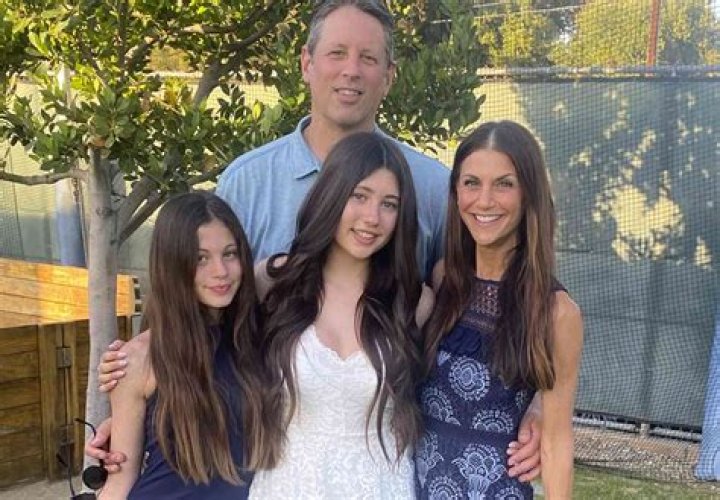 Samantha Harris's family in royal blue attire.