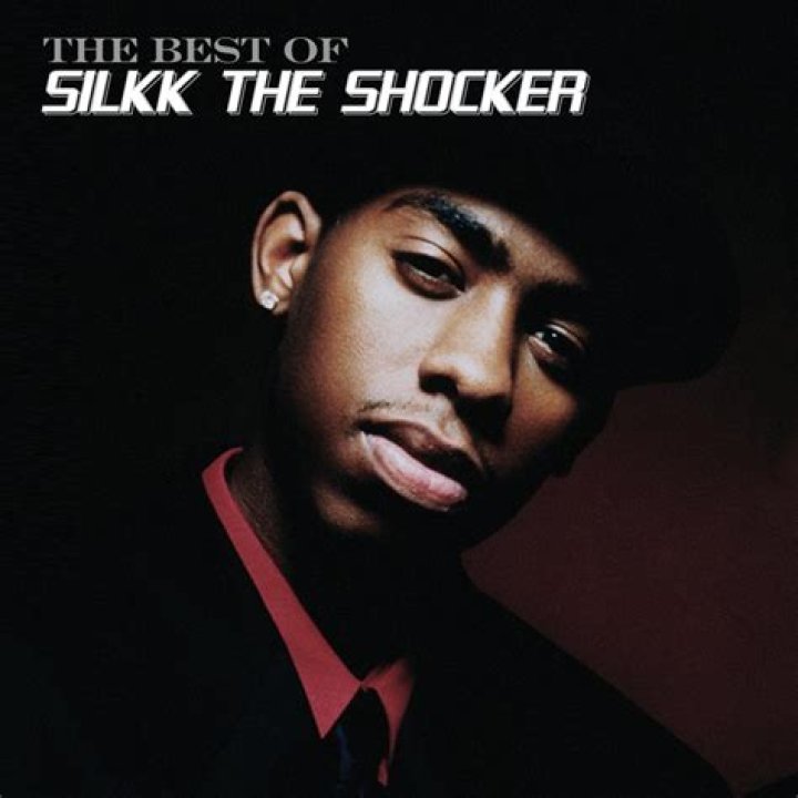 Silkk The Shocker's niece and nephew in black and white formal attires.