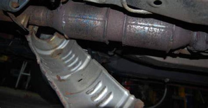 Why does my car rattle when accelerating?